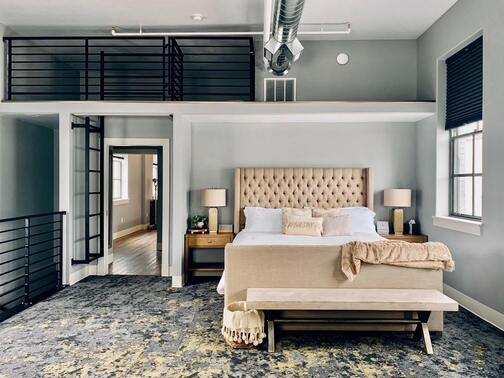 Image of hotel room showing bed