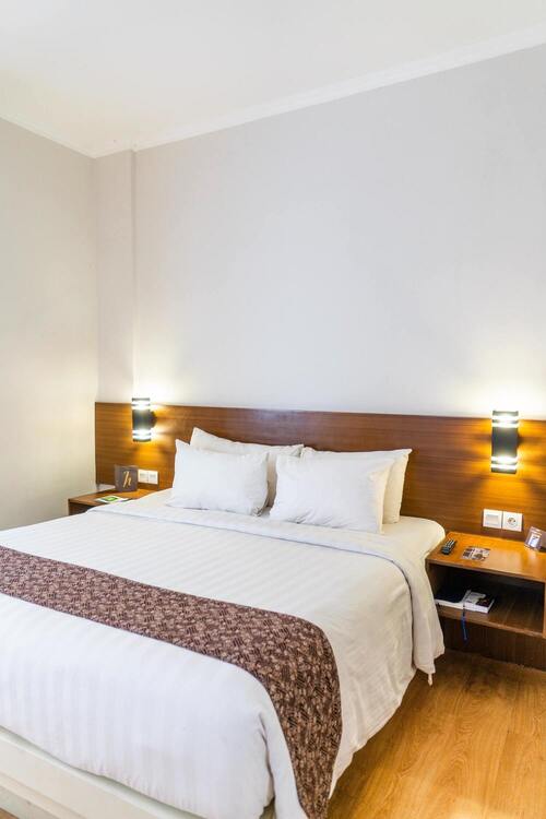 Image of hotel room showing bed